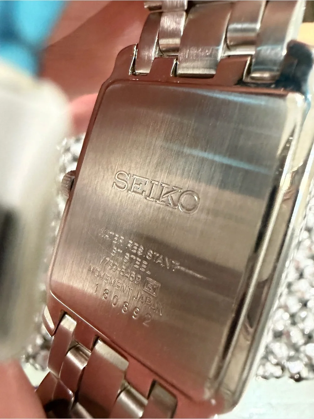 Seiko Silver Watch with Gold Accents and Rectangular Dial